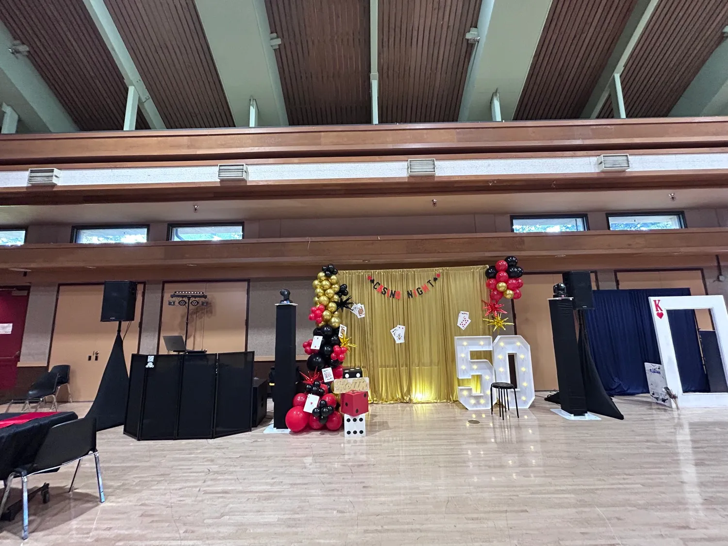 Full DNSB DJ booth, speakers, and lighting set up for an event